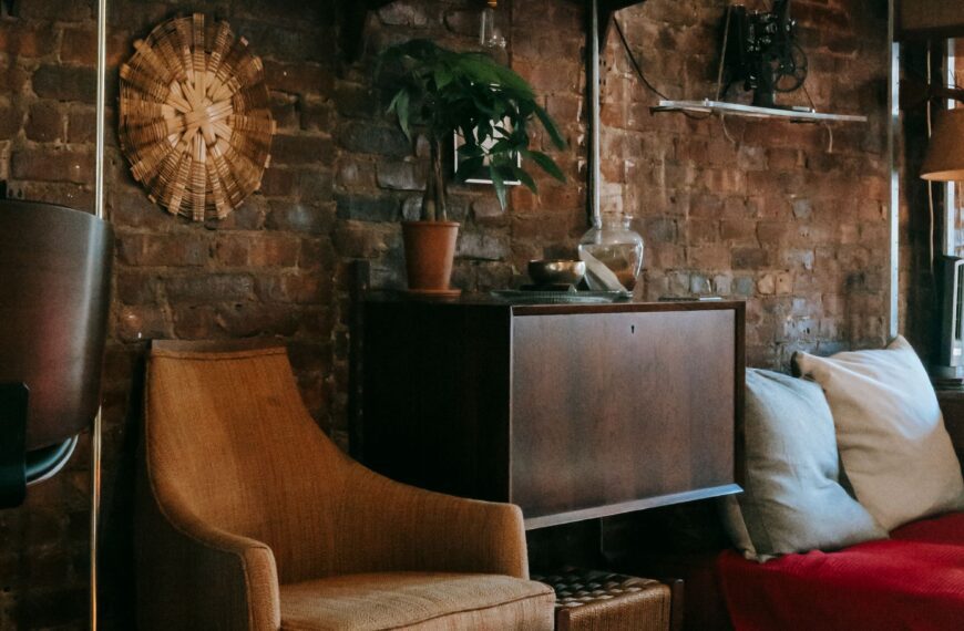 Living room styled with vintage wooden furniture and an ornamental rug, reflecting the rise in antique furniture demand
