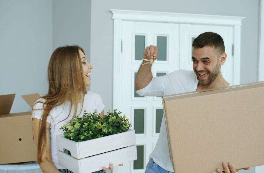 Couple happily moving into a new home