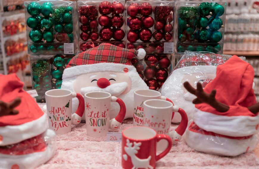 five white-and-red ceramic mugs