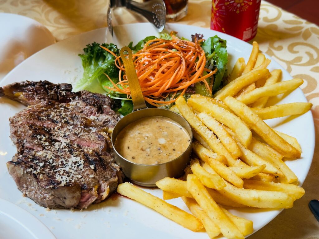 Steak with french fries and side salad
