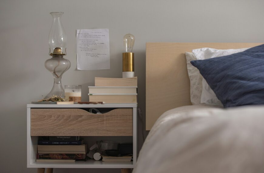 unlighted clear glass gas lamp on end table