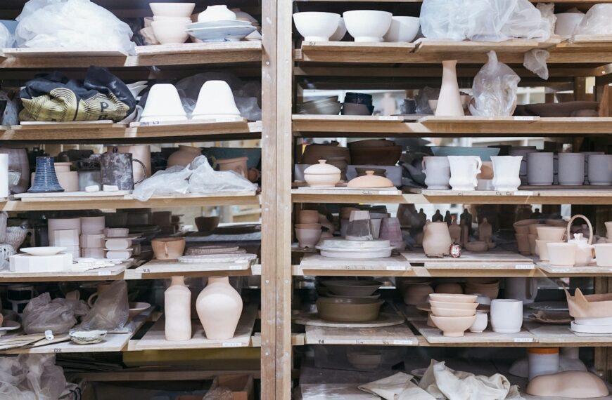 white ceramic teacup on brown wooden shelf