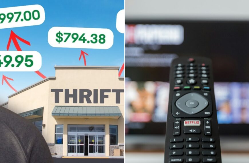 A TV remote control in front of a television screen.