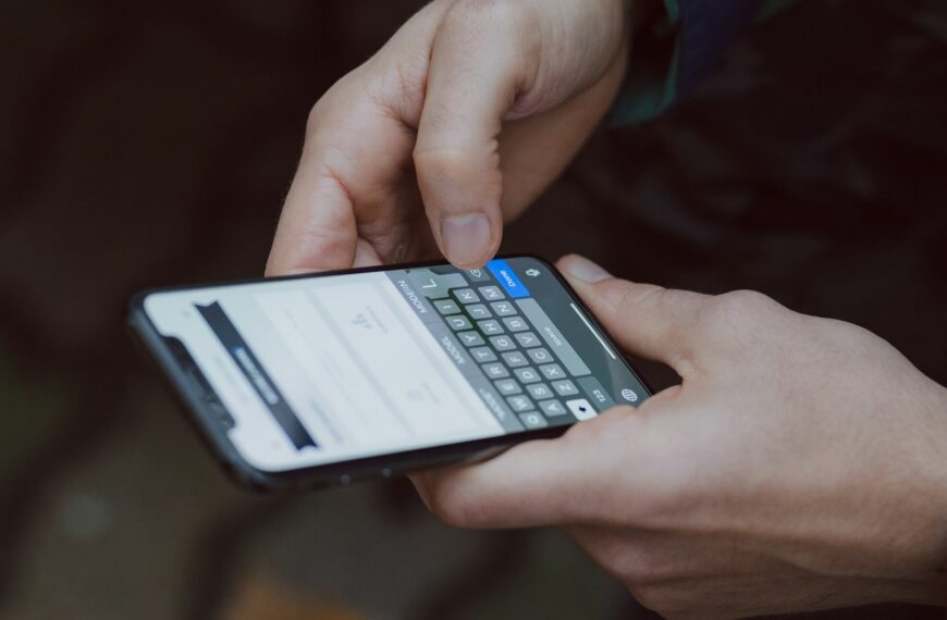 A person typing a message on a smartphone.