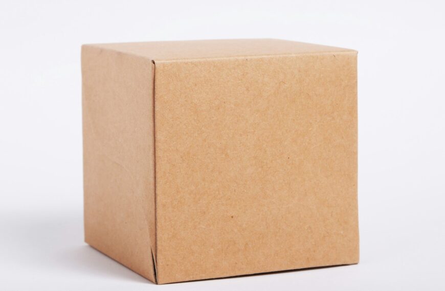 A plain cardboard shipping box on a white surface.