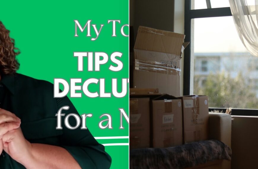 A woman smiling beside a sunlit room stacked with cardboard moving boxes.