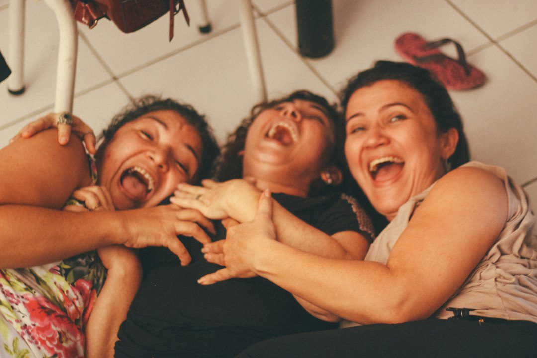 Group of women smiling and laughing together