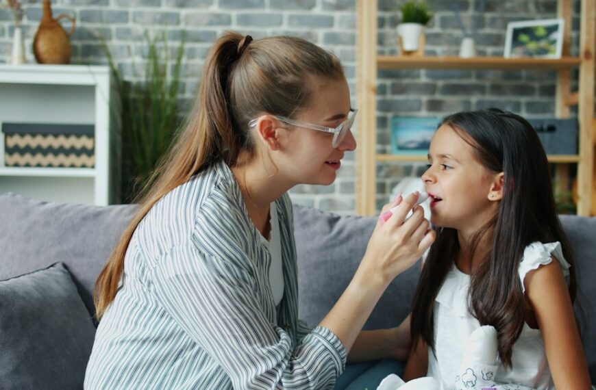 Mother gently comforting her young daughter at home