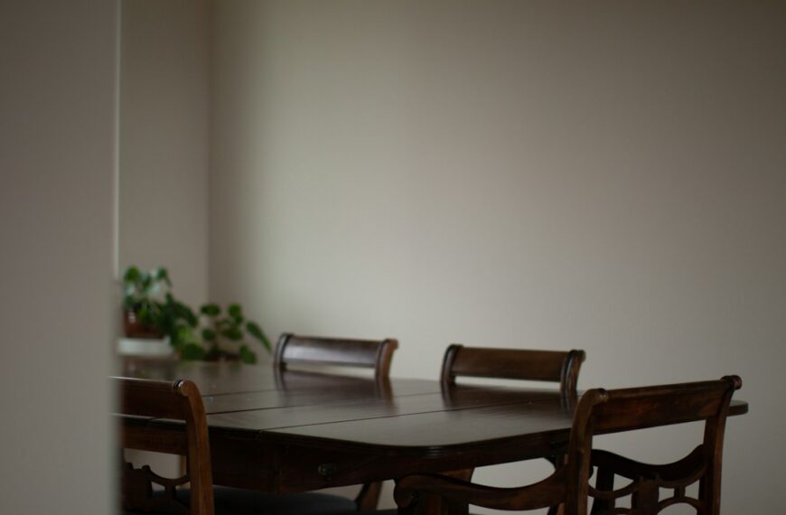 A dining room table with clutter on it