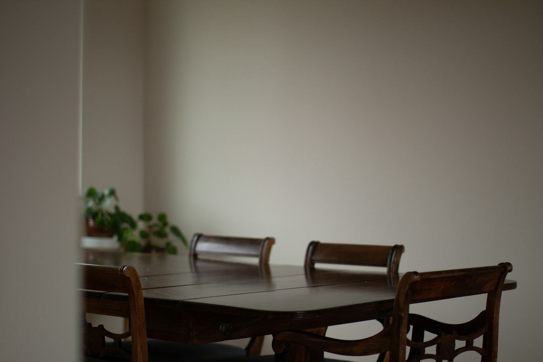 A dining room table with clutter on it