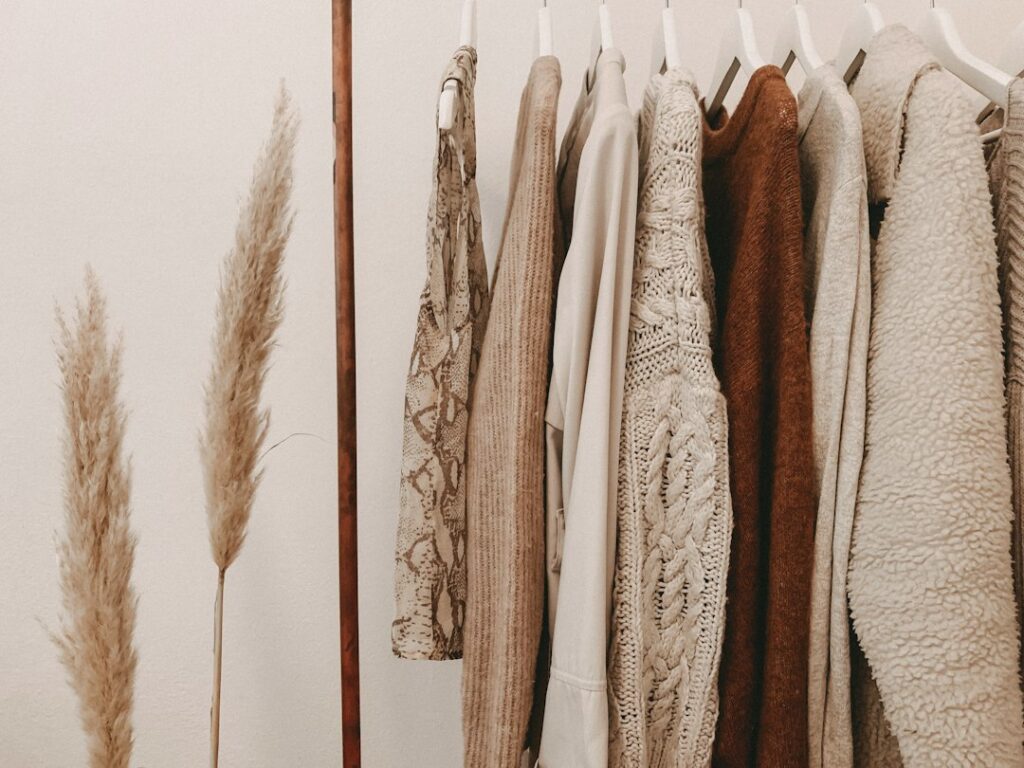 Clothes hanging on a closet rack