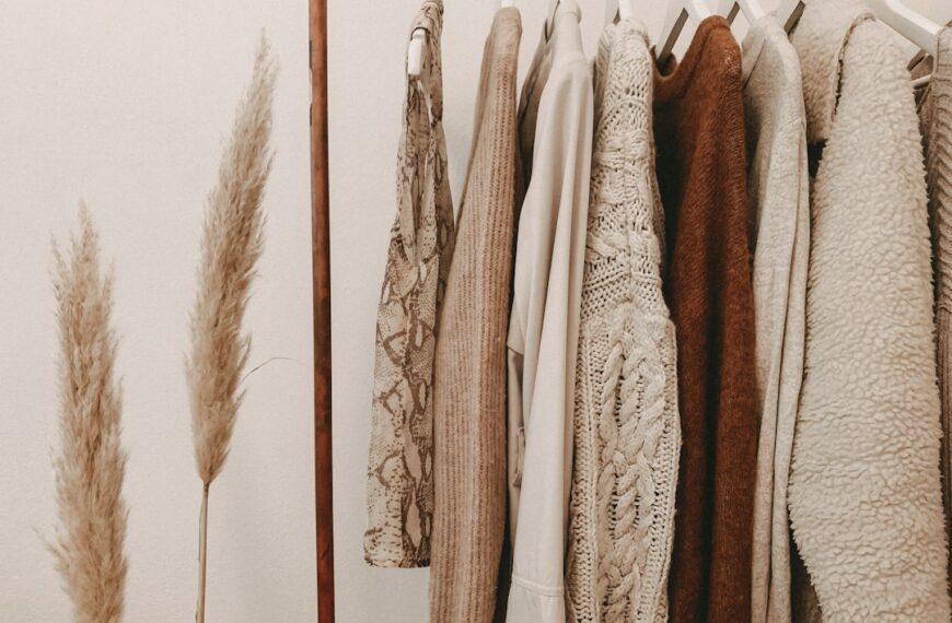 Clothes hanging on a closet rack