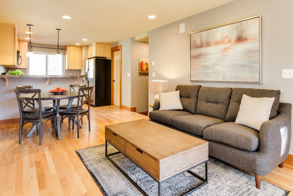 A cluttered living room with couch and coffee table