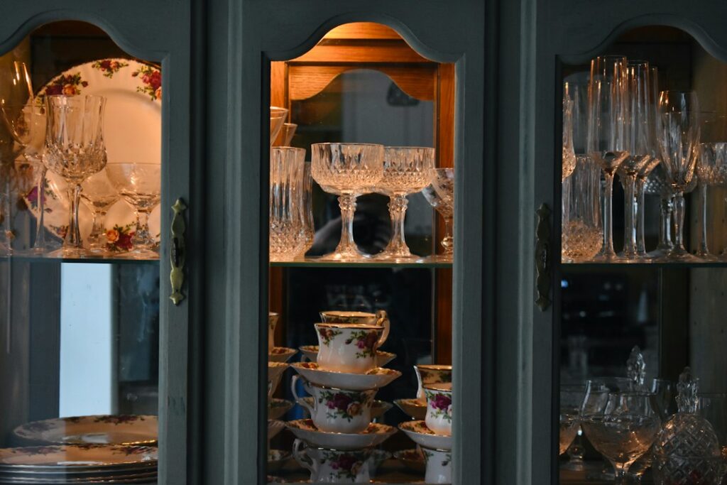 A china cabinet filled with vintage dishes
