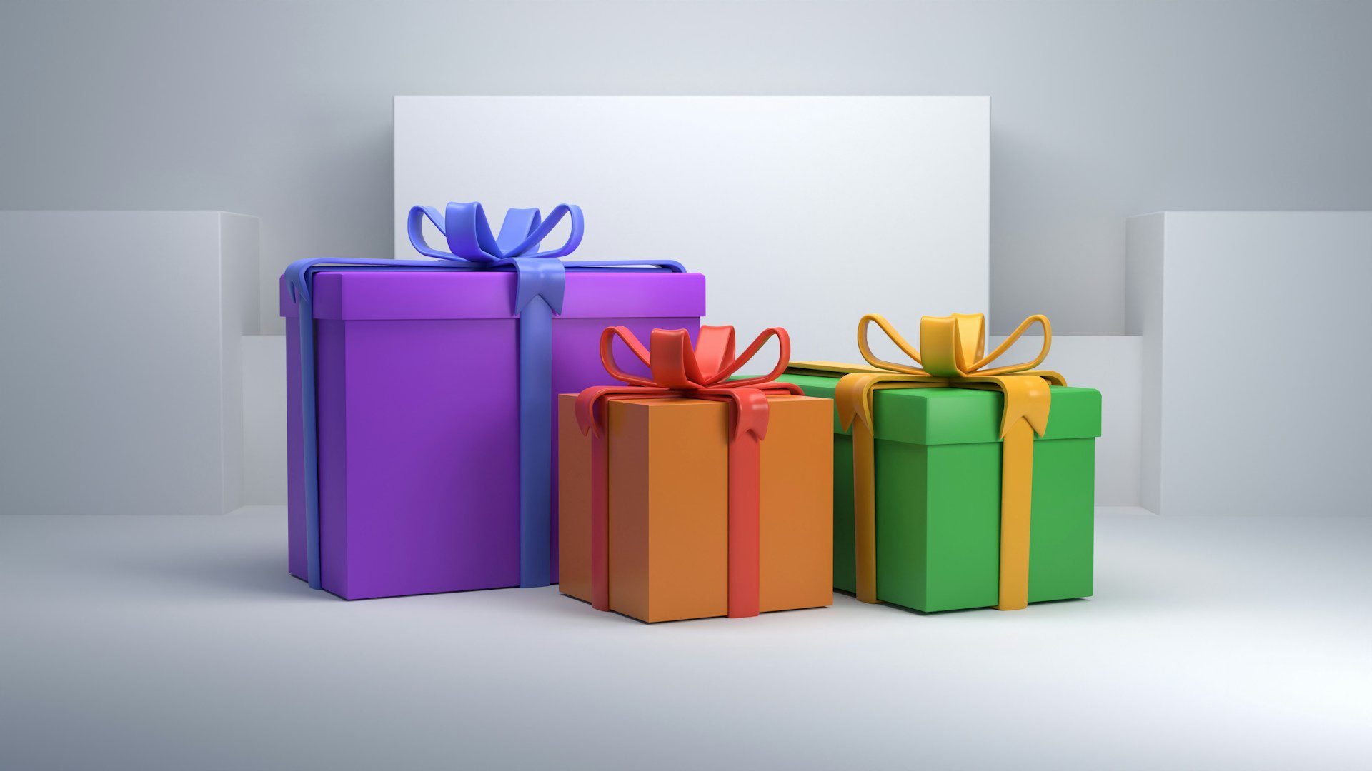 Three colorful gift boxes tied with ribbons.