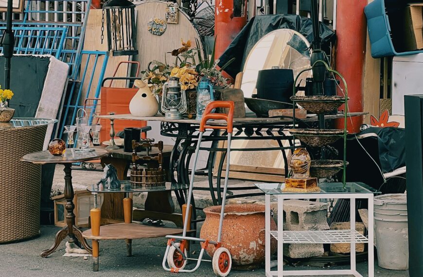 A pile of assorted household items set out for a garage sale.