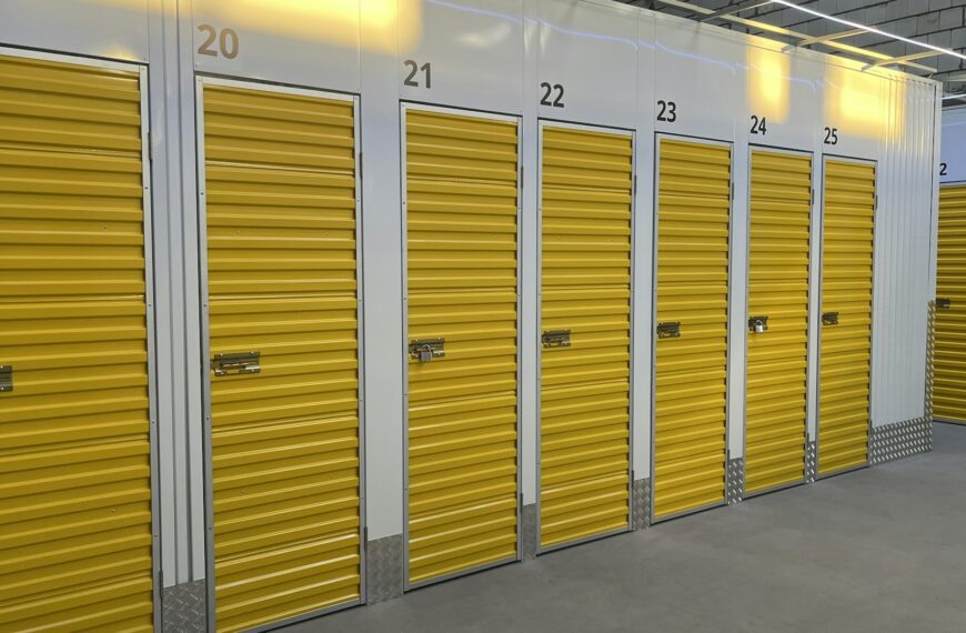 A row of storage units with yellow doors.