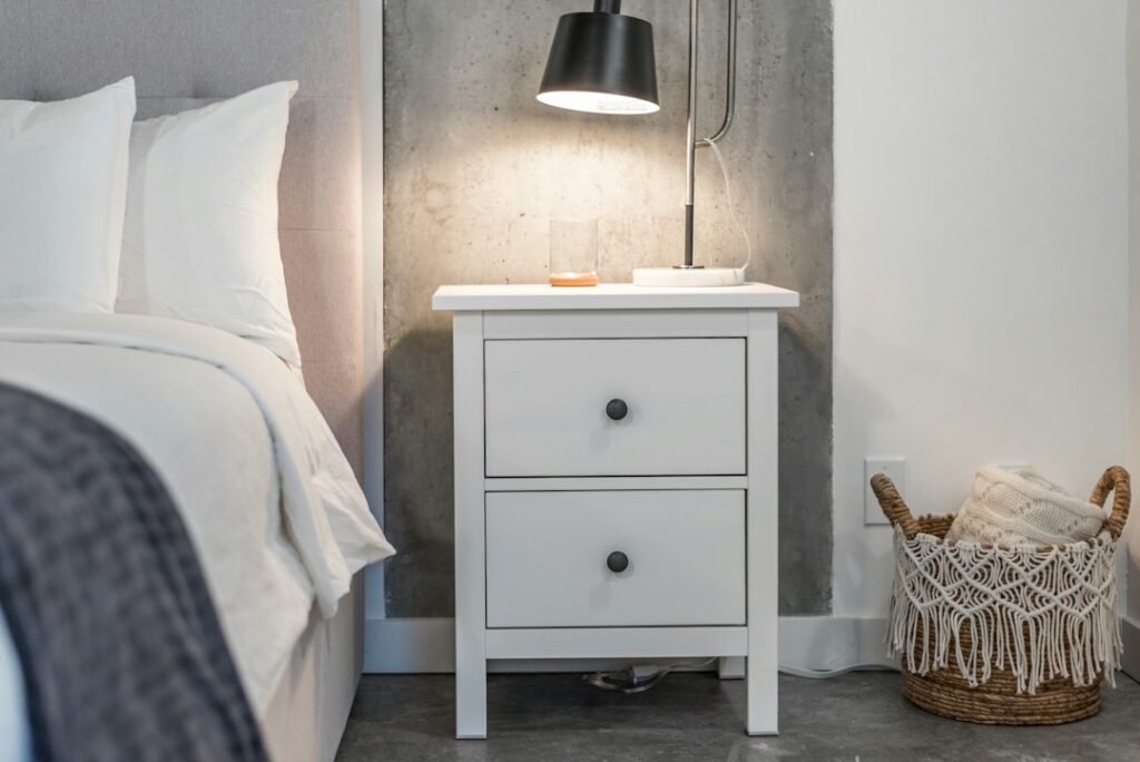 A bedroom nightstand with a drawer