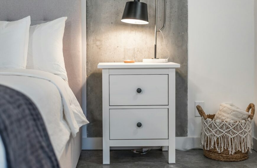 A bedroom nightstand with a drawer
