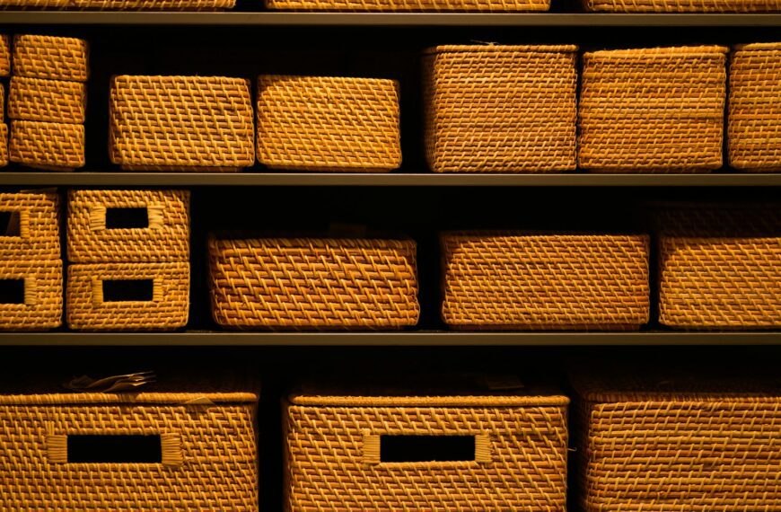 A shelf filled with neatly arranged wicker baskets.