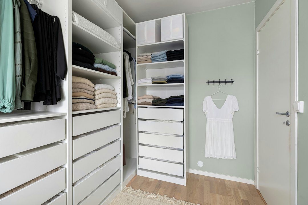 An organized linen closet with folded towels