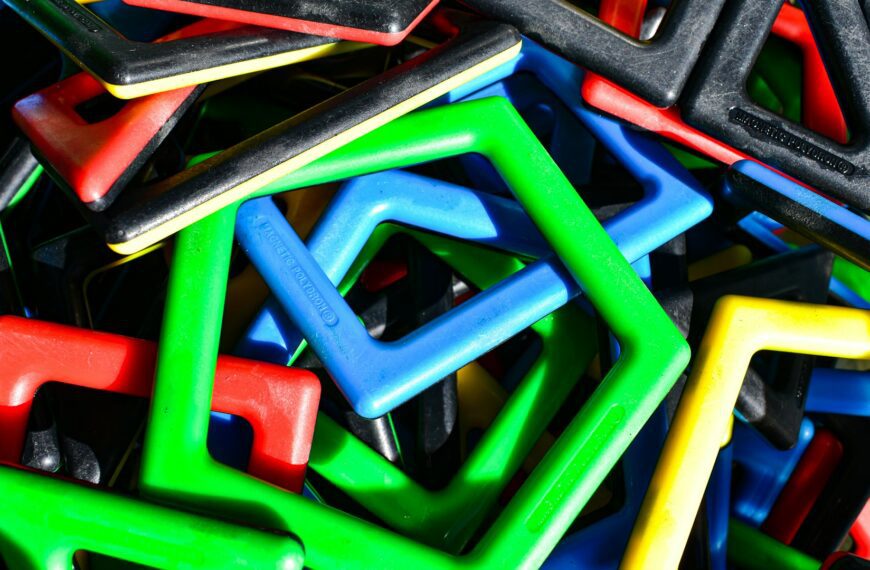A pile of colorful geometric magnetic building toys.