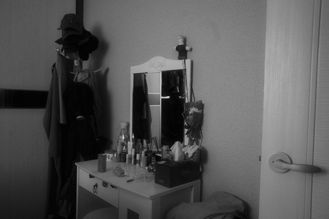 A bedroom dresser with mirror